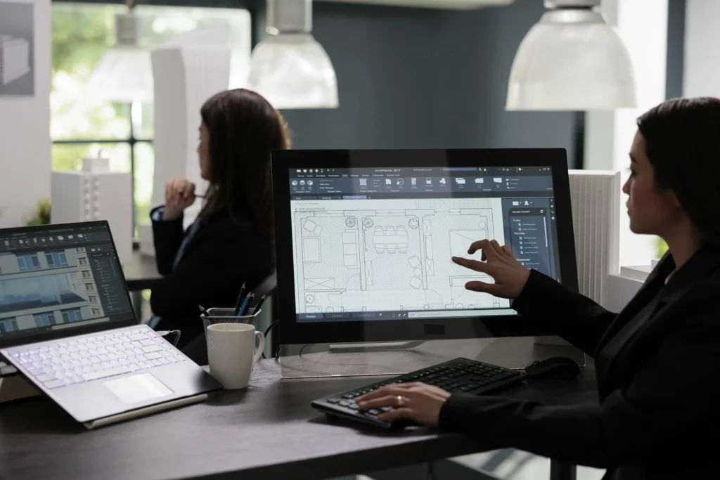 Real estate agent planning room floor in software